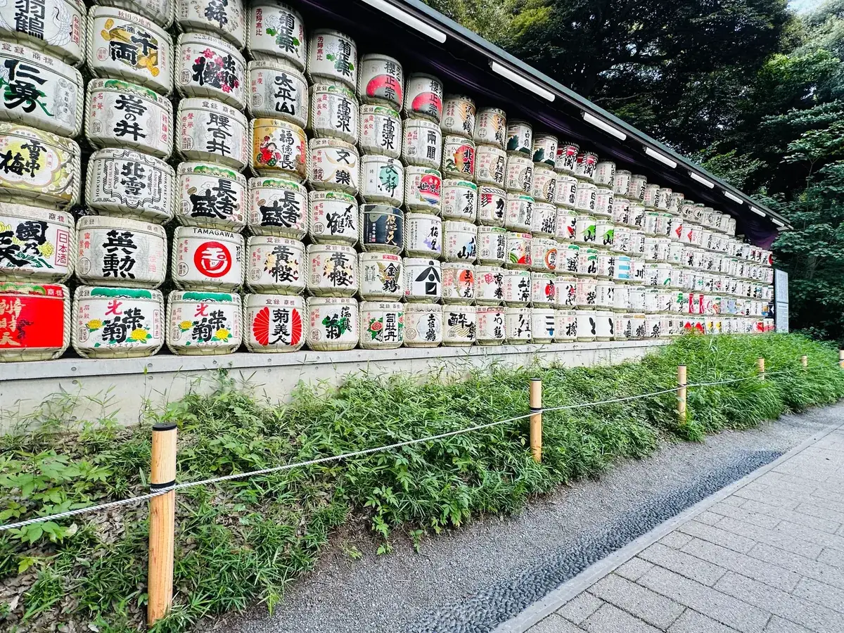 The wall of decorated sake barrels along the approach to Meiji Shrine